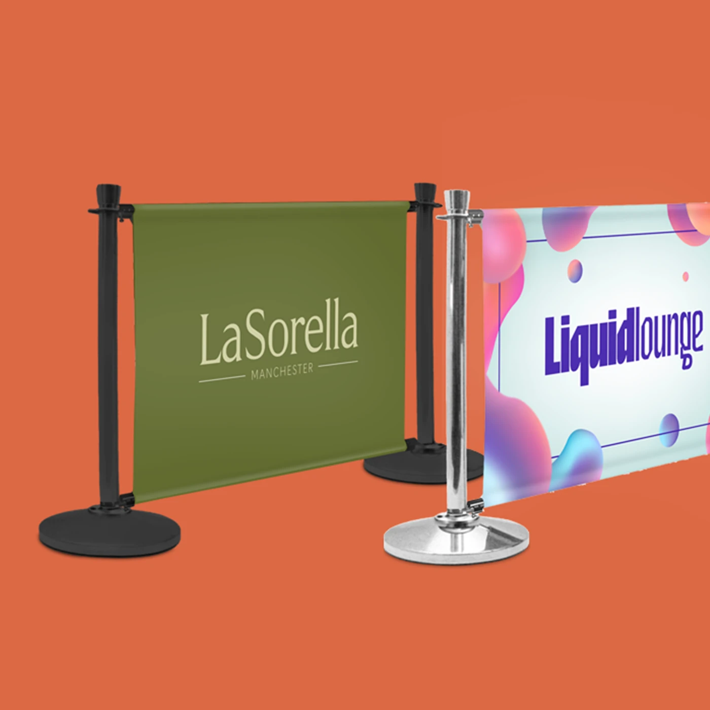 Two branded Single Cafe Barriers against an orange background: one with black posts and an olive green "LaSorella" graphic, and another with a silver post and a white "Liquidlounge" graphic featuring pink and blue abstract shapes.