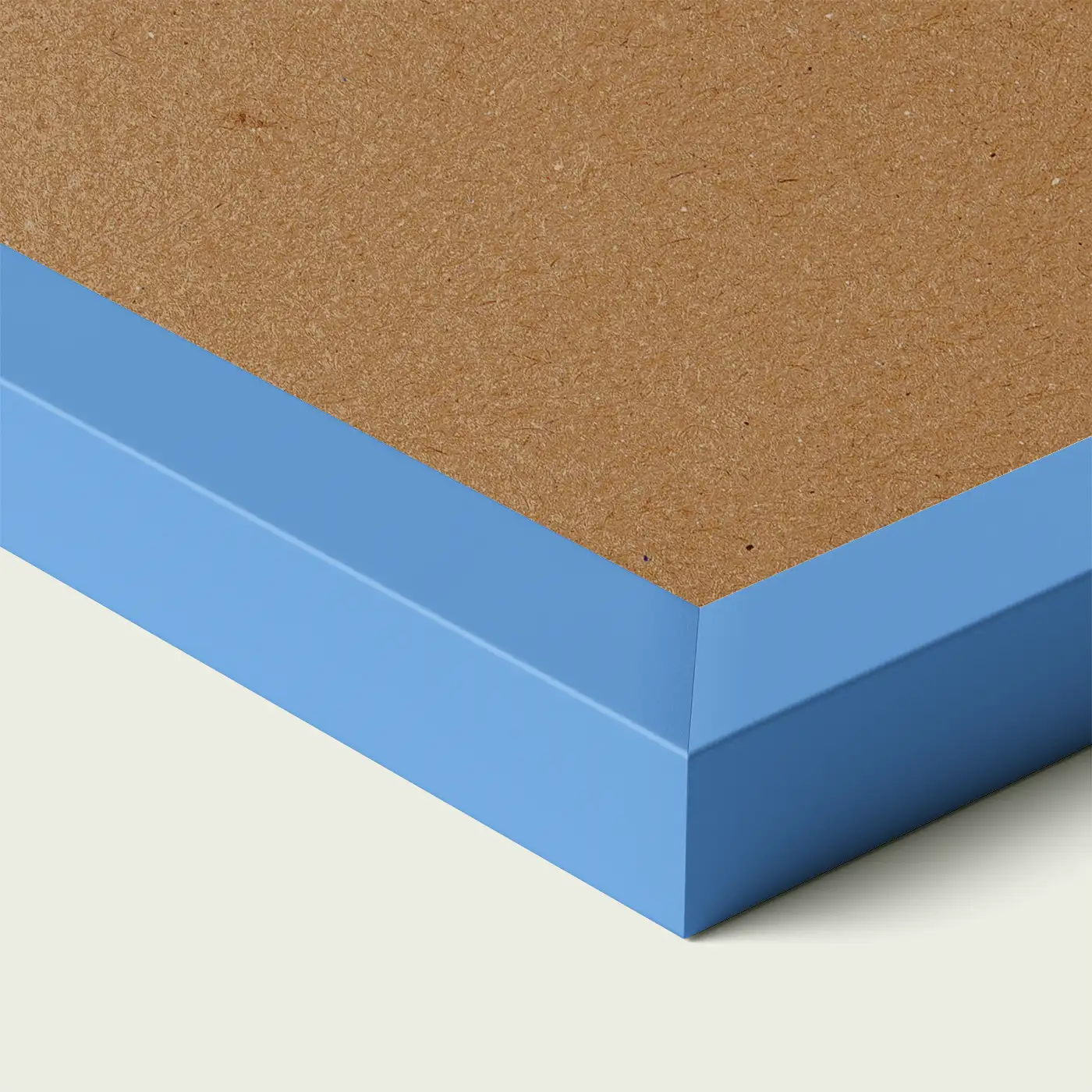 Close-up of a blue picture frame corner with smooth painted edge and wooden backing, shown against a light neutral background