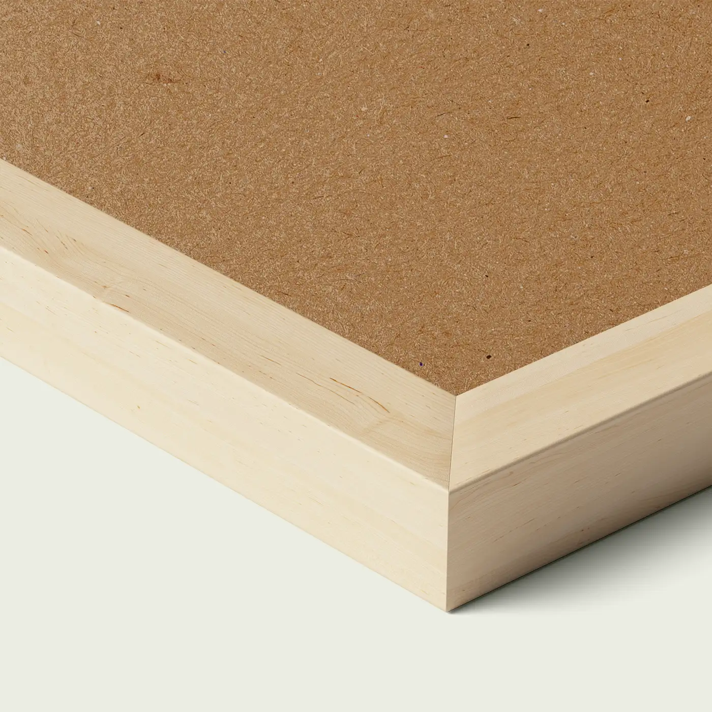 Close-up of an obeche picture frame corner with smooth painted edge and wooden backing, shown against a light neutral background
