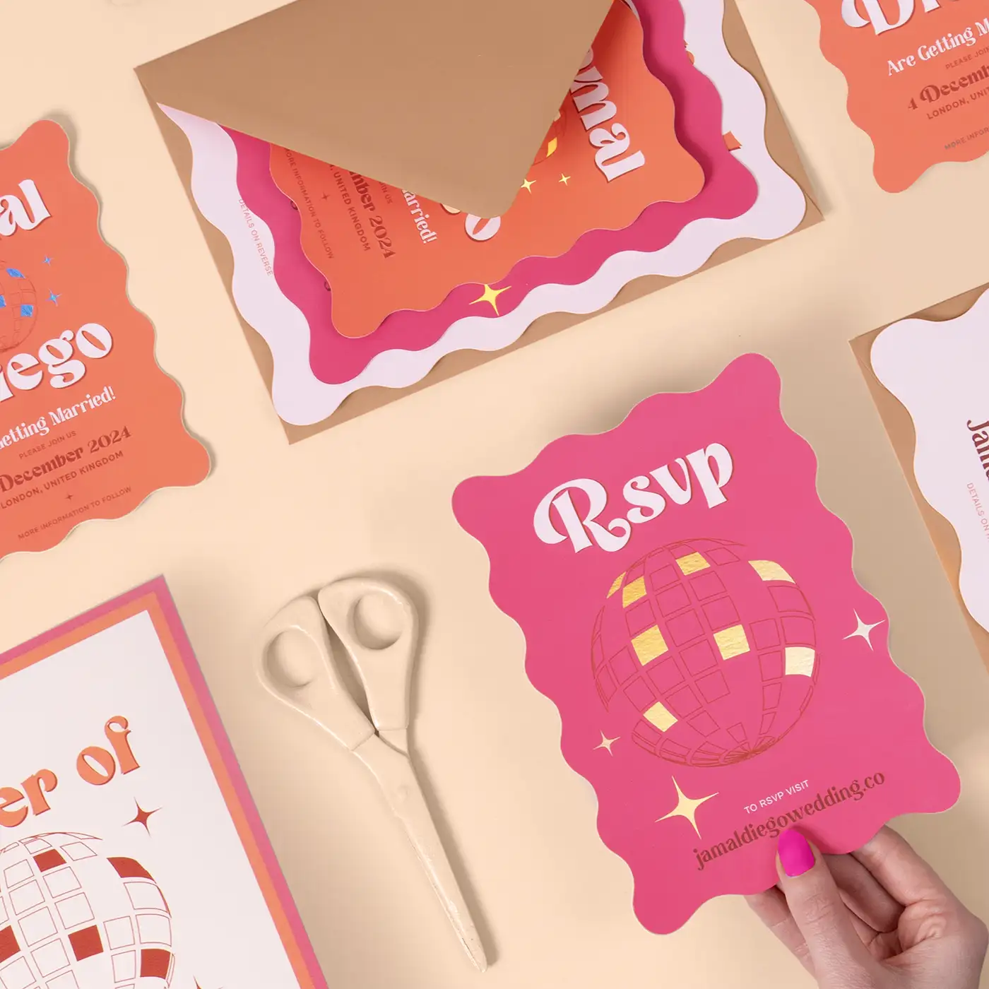 Colourful wedding stationery set with wavy-edged Invitations and RSVP Cards.