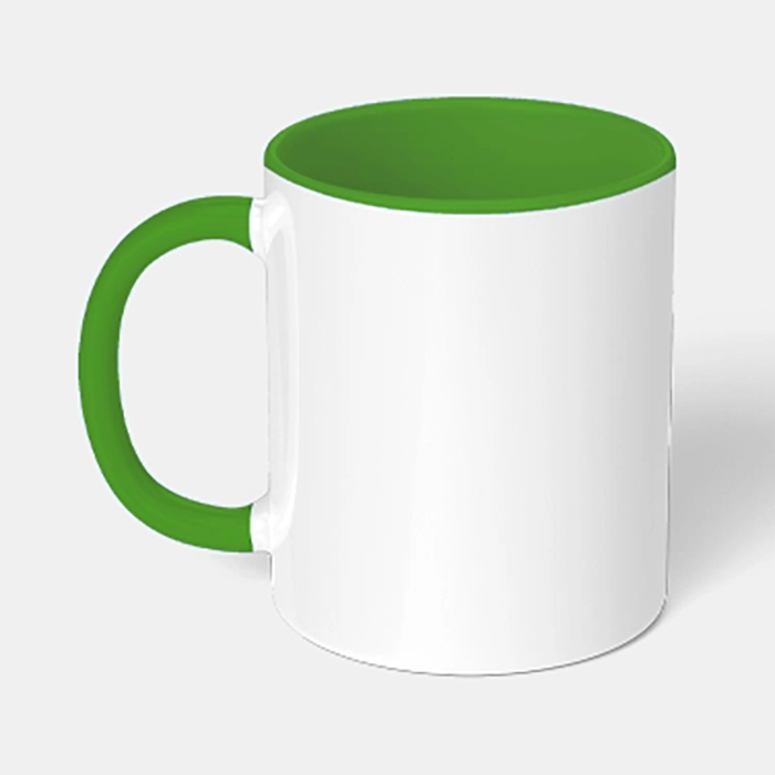 White ceramic mug, with a green handle and inner, on a grey background.