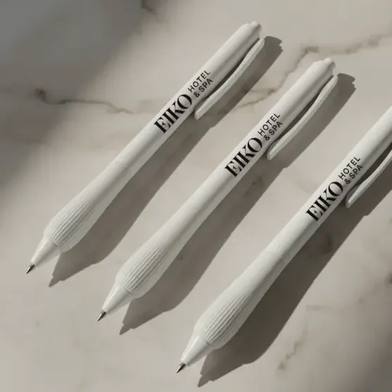 Three branded and white Hotel and Spa Edit Pens, lying side by side on a surface
