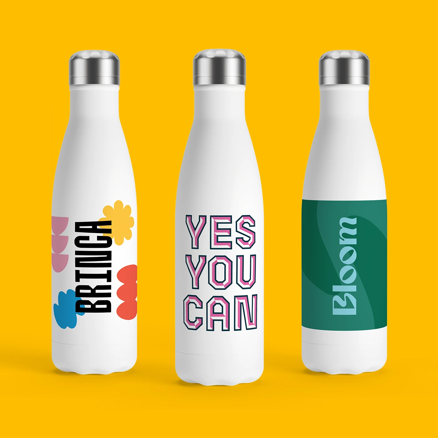 Three white reusable bottles with printed text and patterns, displayed upright on a yellow backdrop.