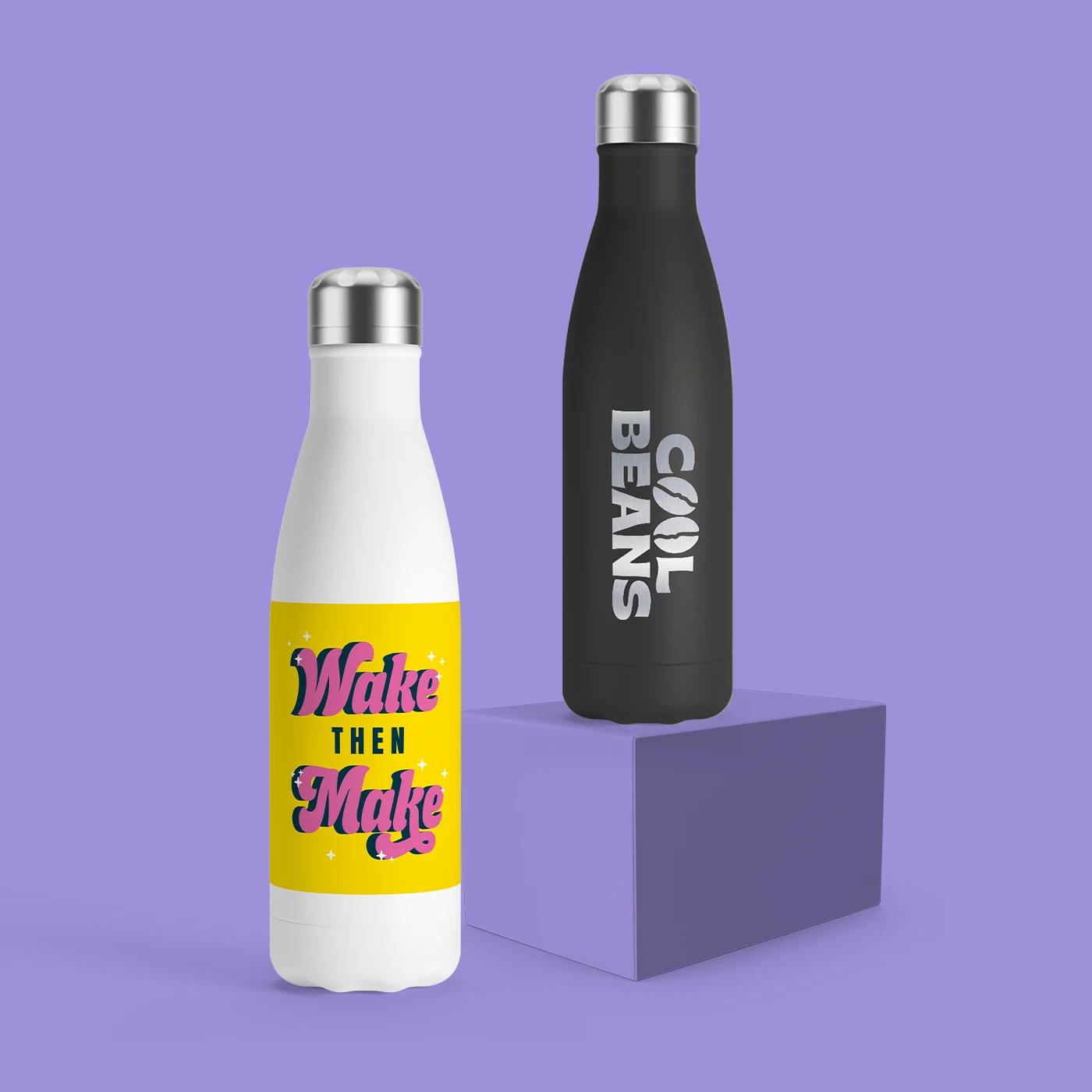 Two insulated bottles with printed slogans, upright on a purple surface with matching background.