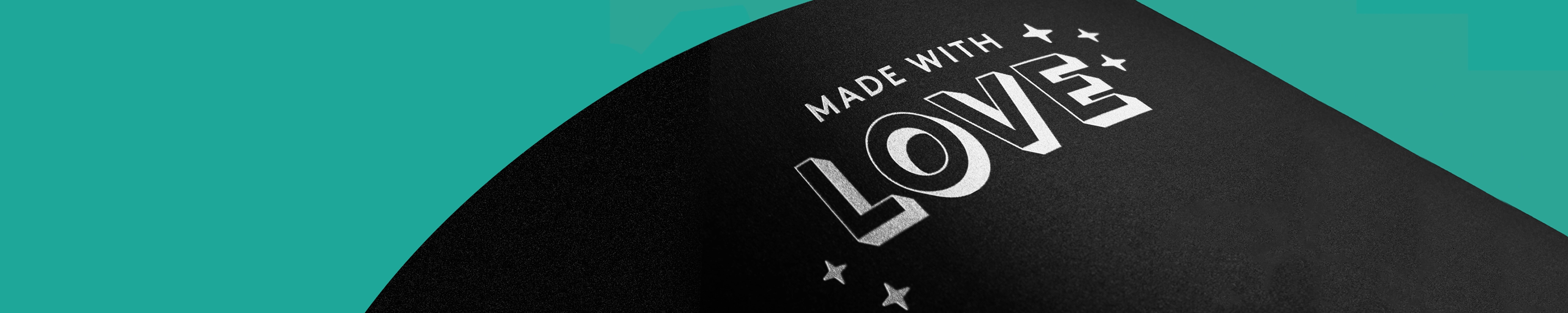 Black coloured print with bold white ink text reading “MADE WITH LOVE”