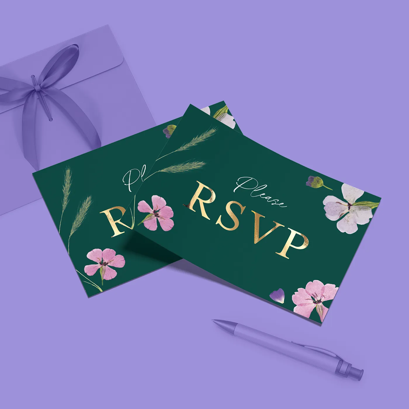 Two dark green floral Wedding RSVP cards with pink blossom illustrations and gold foiled lettering.