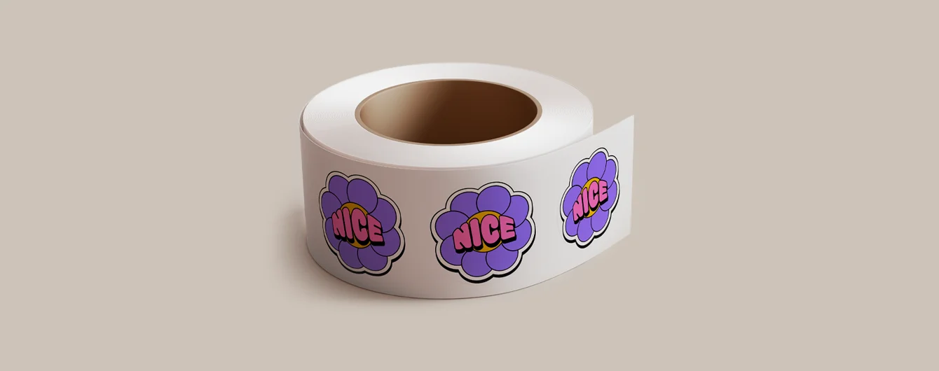 Stickers on a roll with a repeating design featuring a purple five-petal flower with scalloped edges. Each flower has the word “NICE” in bold pink letters outlined in black