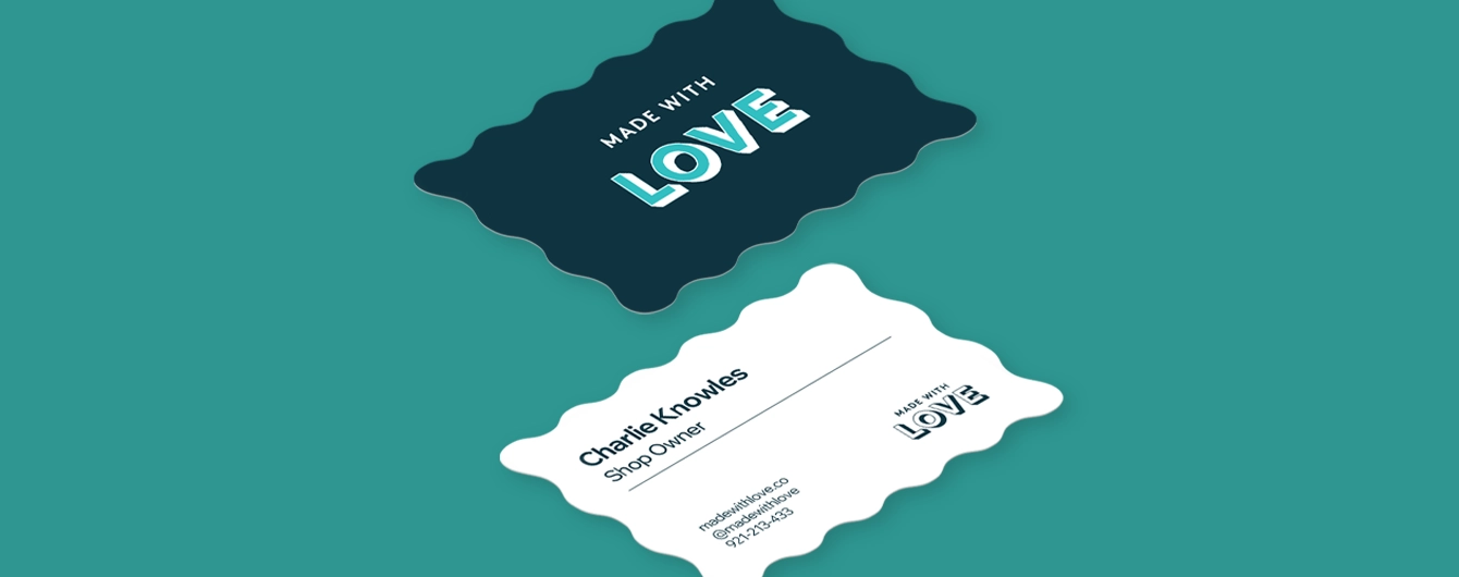 Two wavy-shaped Business Cards: one dark blue with bold “MADE WITH LOVE” text, the other white with contact details.