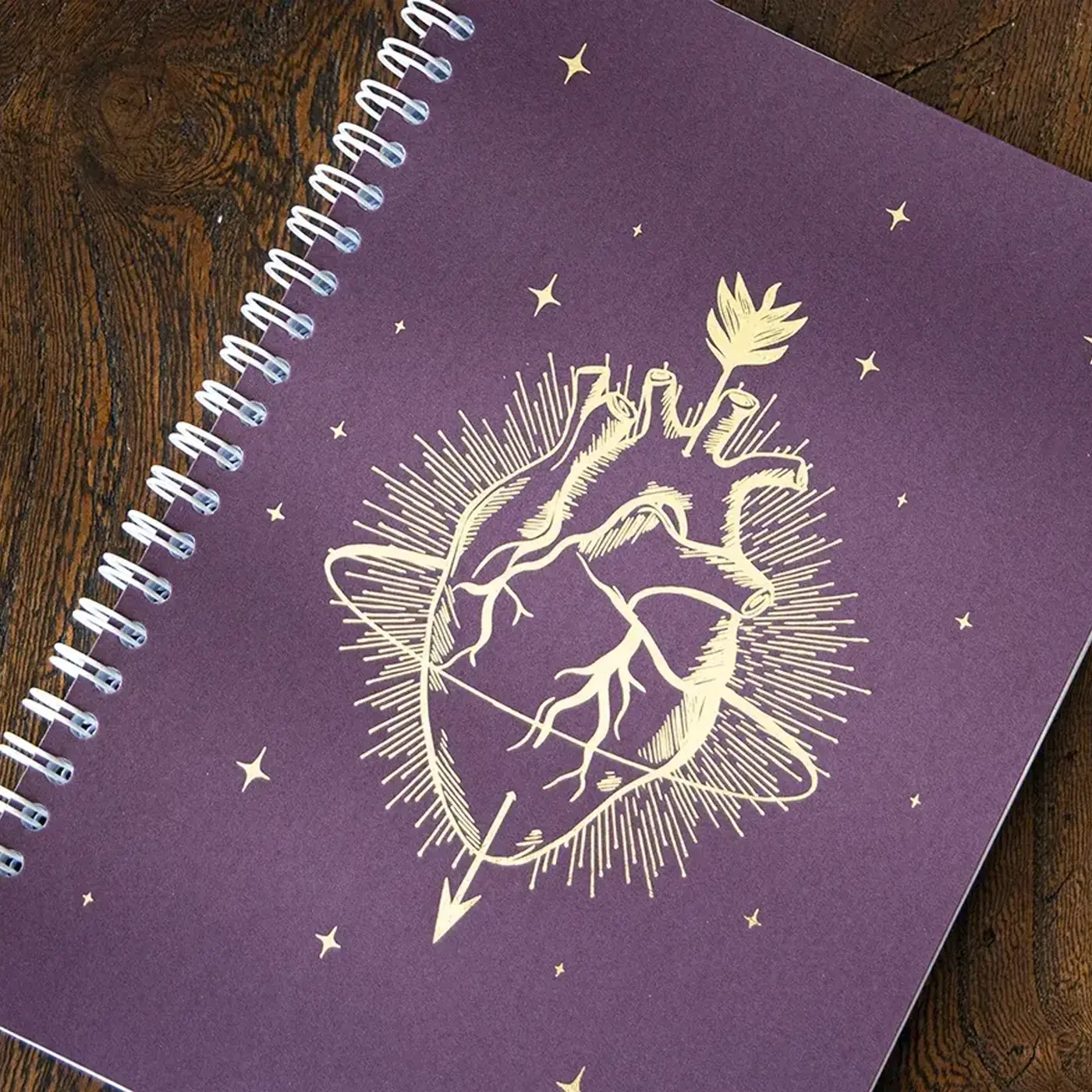 Purple Spiral Bound Notebook with a gold foil anatomical heart on the cover.