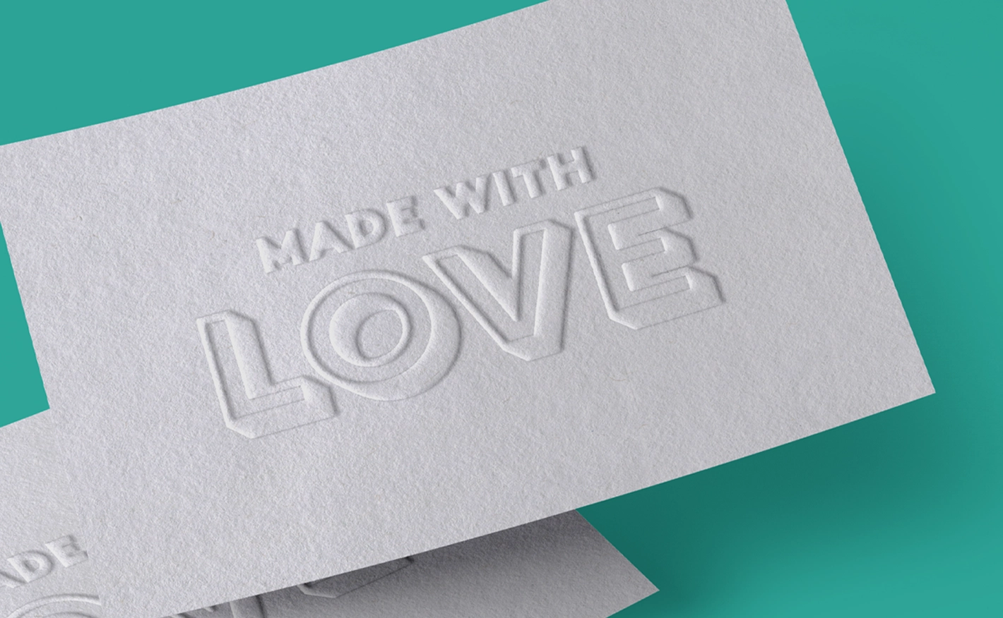 White textured Business Card reading "MADE WITH LOVE" in embossed text.