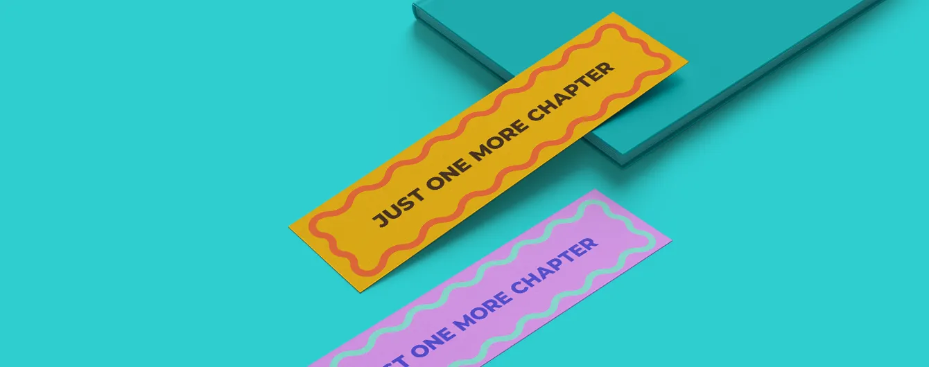 A pink and yellow Bookmark with 'Just one more chapter' written on them