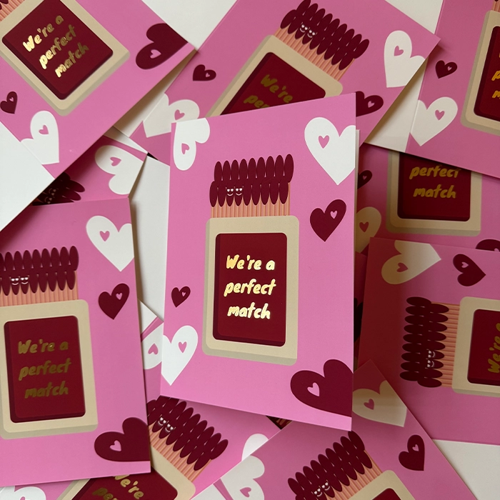 Gold foiled valentine's Greeting Card arrangement with the text 'we're a perfect match'.