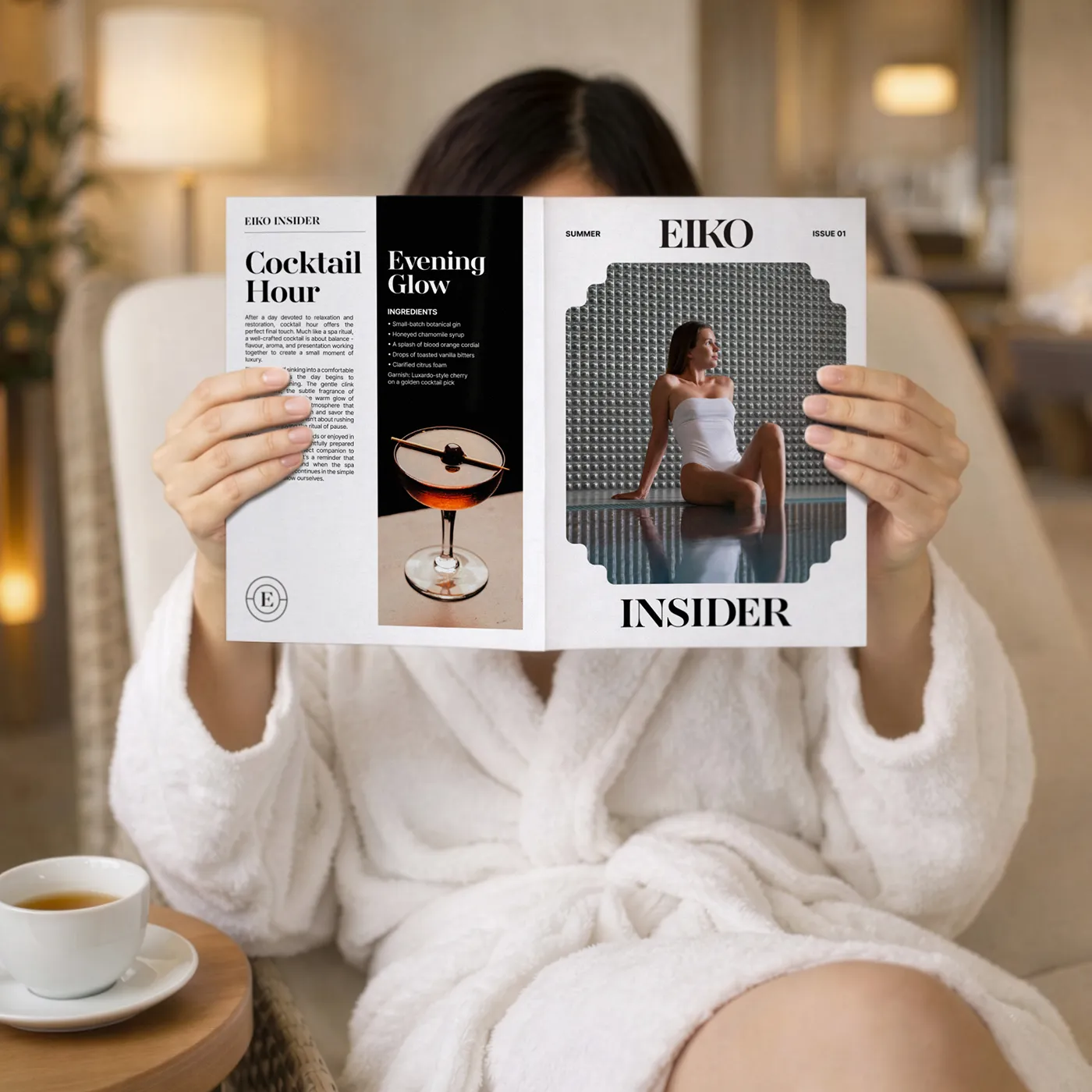 Lifestyle newspaper held in a spa setting against a warm, neutral background.