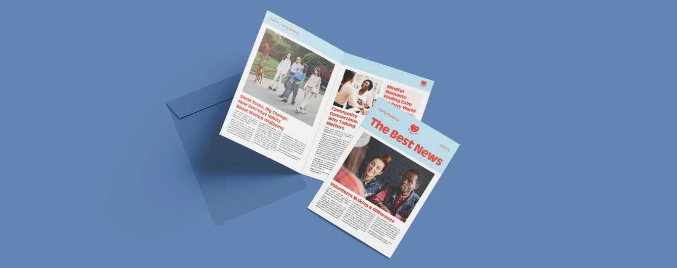 Community newspaper opened on a bold blue background with a matching envelope.