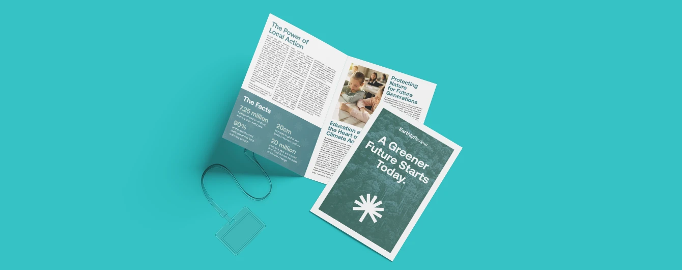 Eco‑themed newspaper shown open on a vibrant turquoise backdrop.