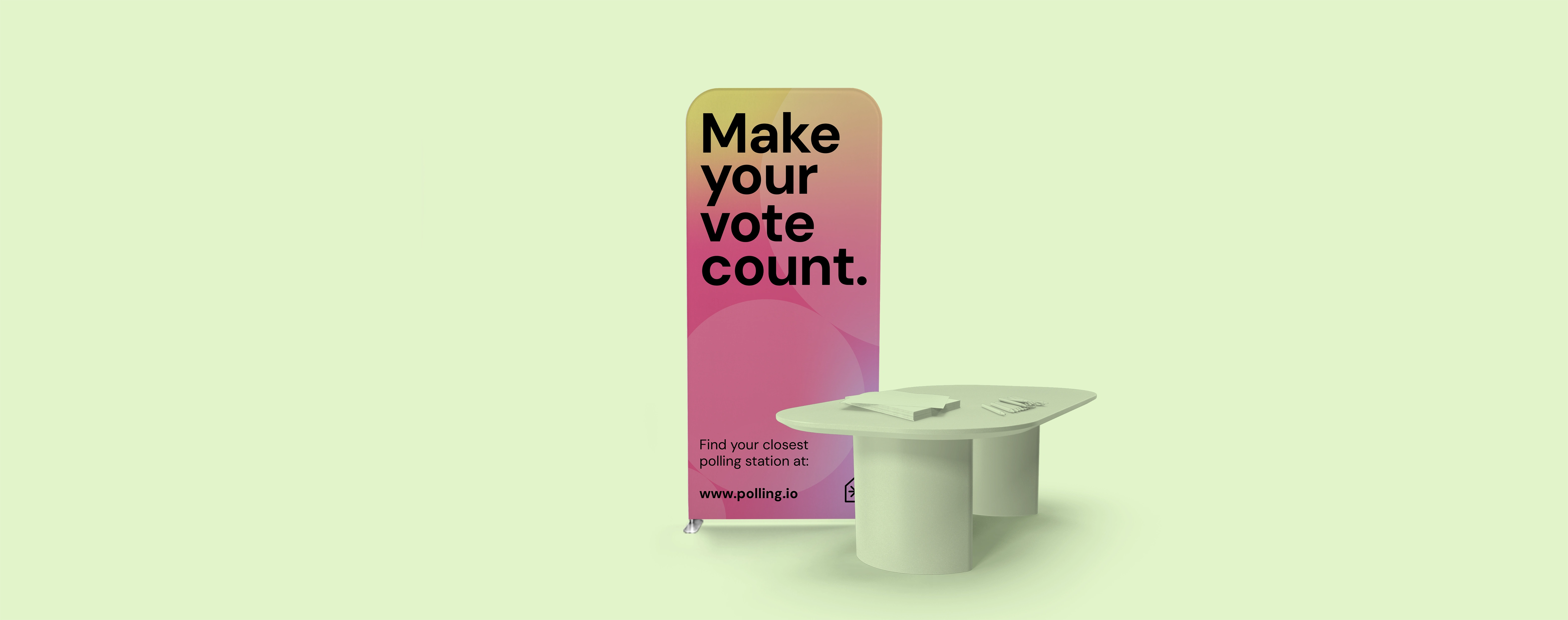 A stretch fabric display stand set up for a voting station with a booth on a bright backdrop.