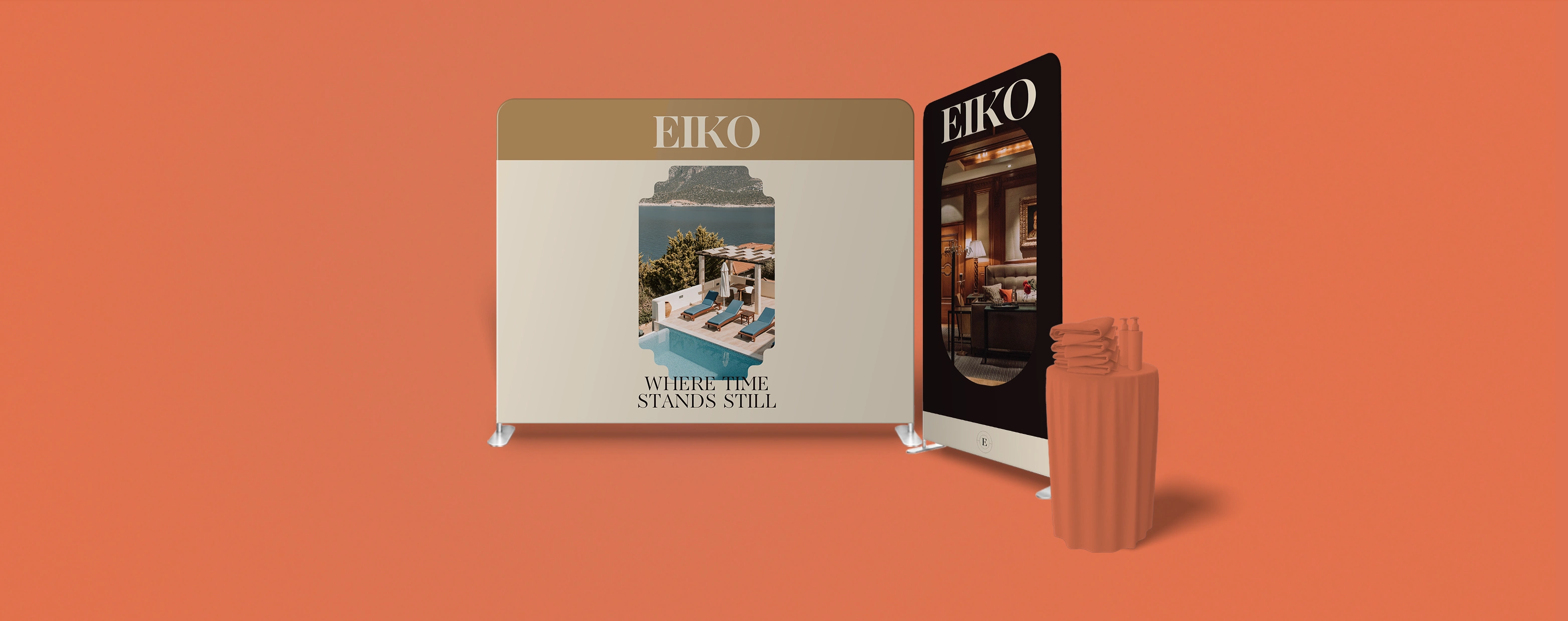 A stretch fabric display stand for a luxury brand with a small product table on an orange backdrop.