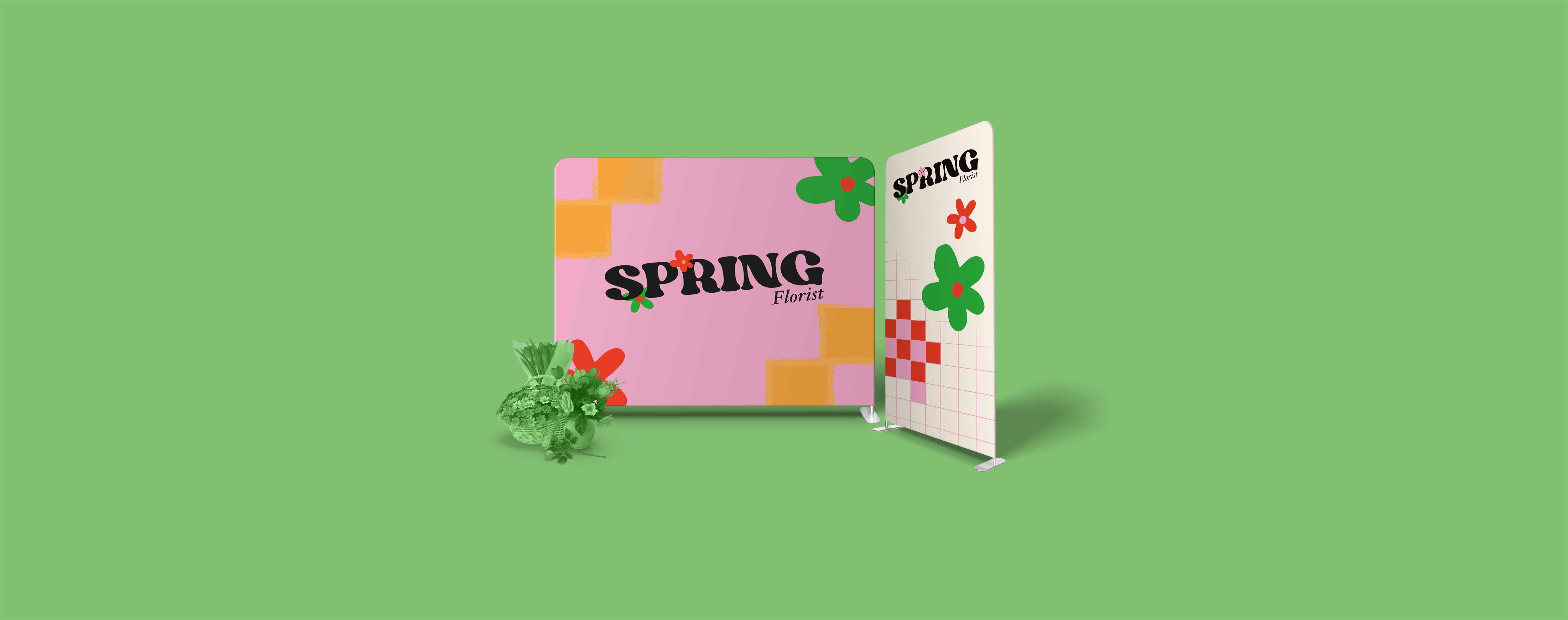 A stretch fabric display stand for a florist brand with flowers arranged on a bold green backdrop.