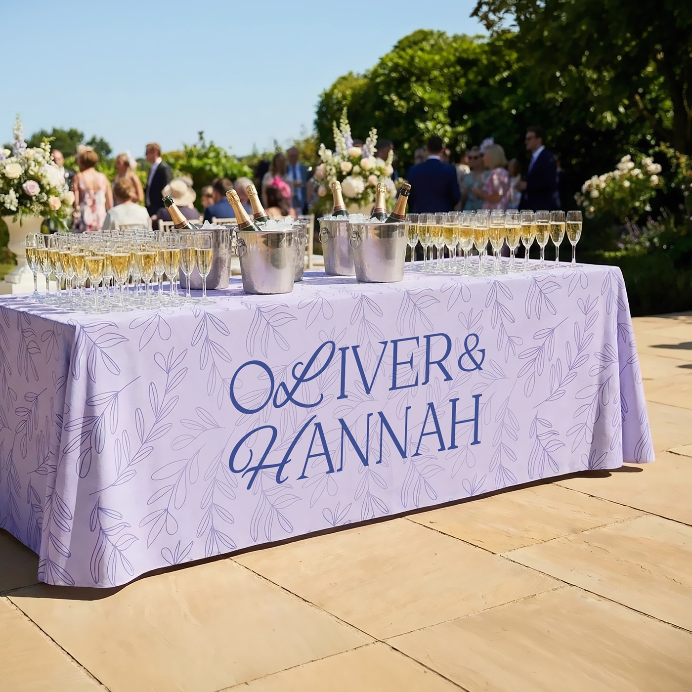 Rectangular tablecloth used on an outdoor drinks table at a wedding.