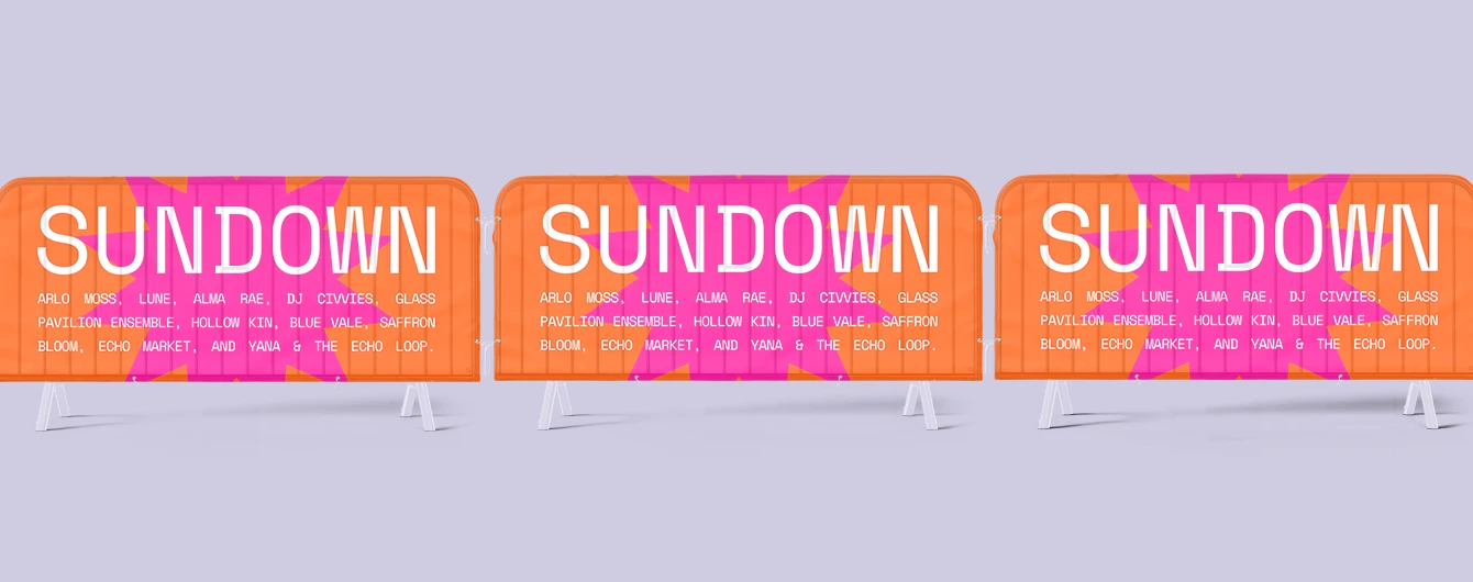 Bright crowd barrier covers arranged in a row on a plain backdrop for a festival‑style setup.