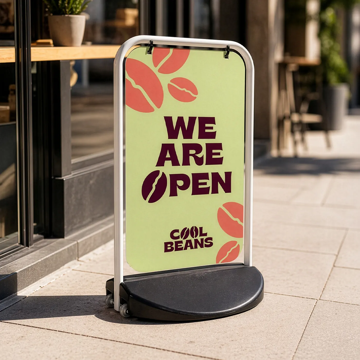 An outdoor Swing Board for "Cool Beans" featuring coffee bean illustrations and text: "We are open."