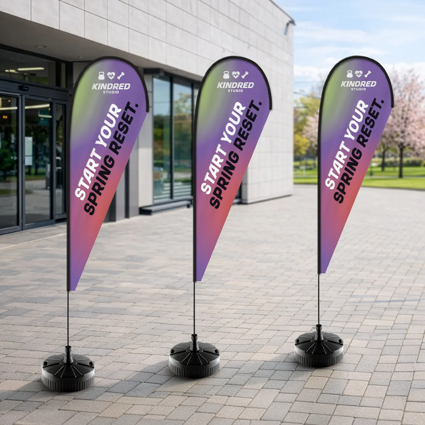 Three Teardrop Flags for "Kindred Studio" with a purple and green gradient, featuring the text "Start your spring reset."