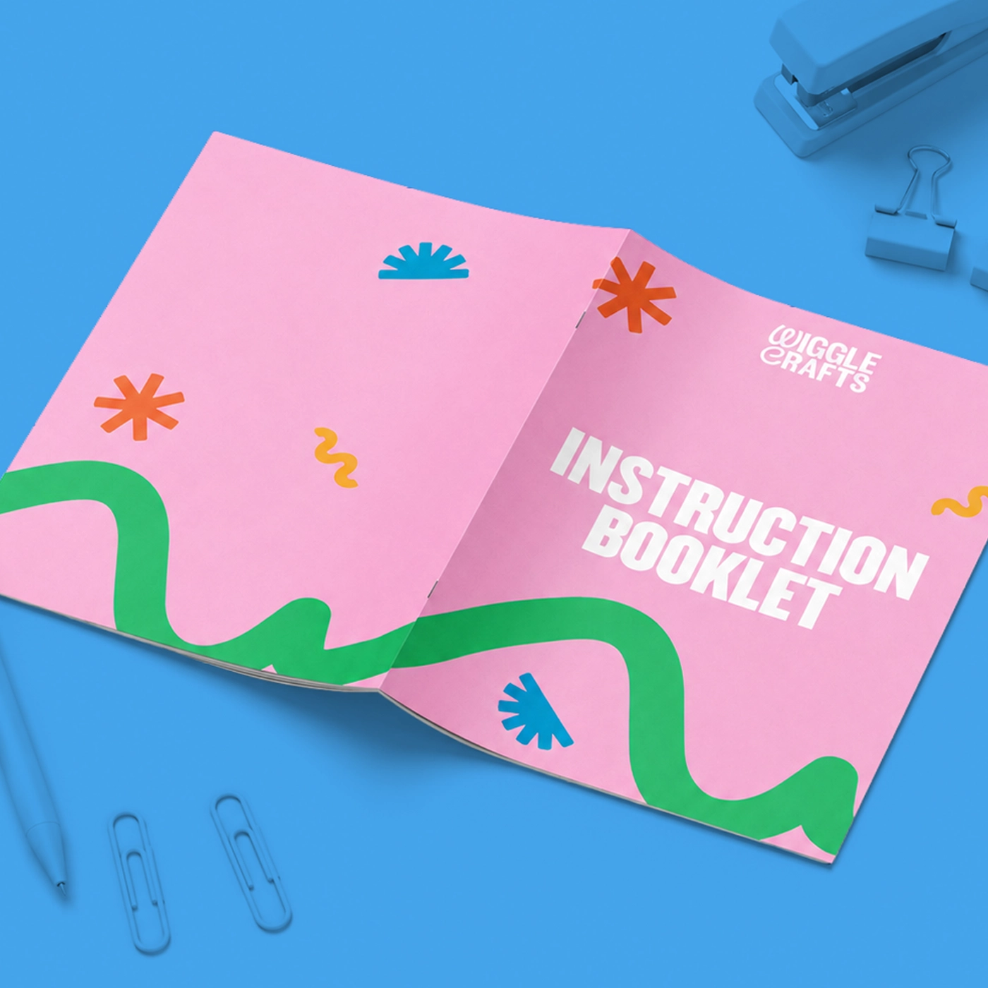 Saddle stitch "Instruction Booklet" Manual laid flat open.