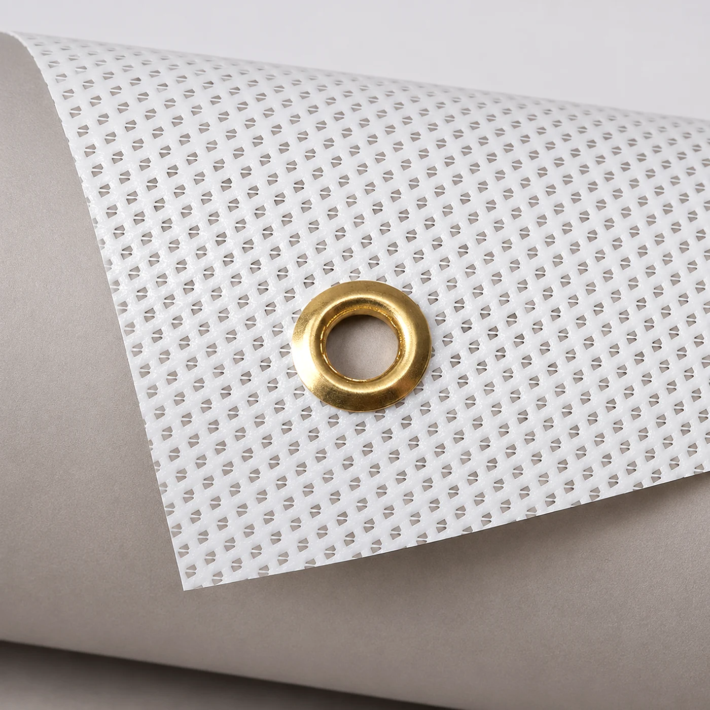 Mesh Banner closeup with reinforced brass eyelet.