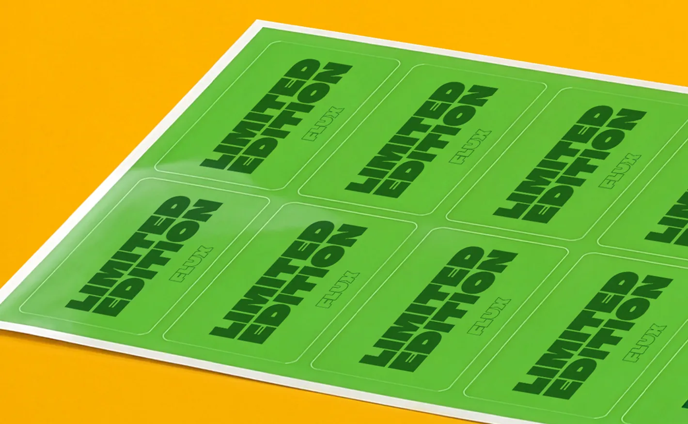 A backing sheet filled with green rectangular stickers printed with the bold text "LIMITED EDITION FLUX" on a vibrant yellow surface.
