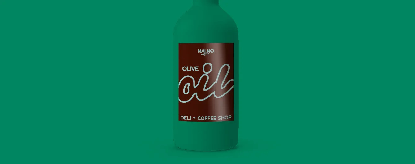 A dark brown rectangular label reading "MALMO coffee OLIVE OIL DELI + COFFEE SHOP" applied to the front of a matte green glass bottle.