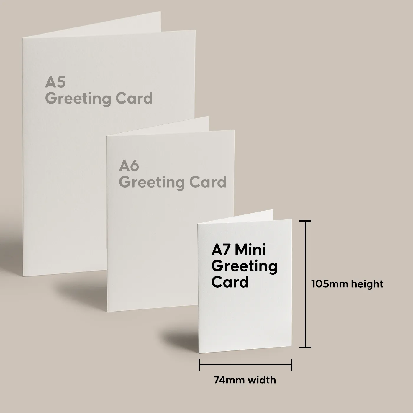 Three white Greeting Cards shown in decreasing size order: A5 Greeting Card, A6 Greeting Card, and A7 Mini Greeting Card measuring 74mm wide by 105mm high.