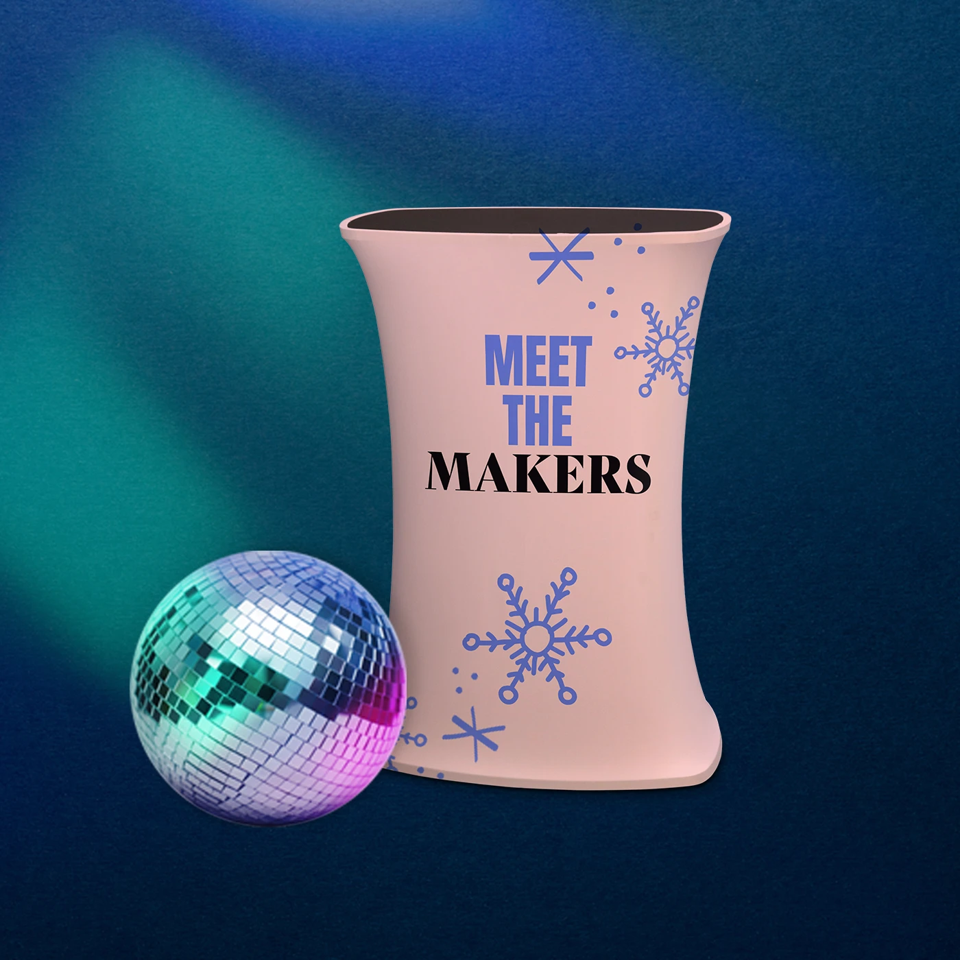A Christmas Pop Up Counter reading "MEET THE MAKERS" decorated with snowflake graphics stands on a blue background next to a large, glowing disco ball