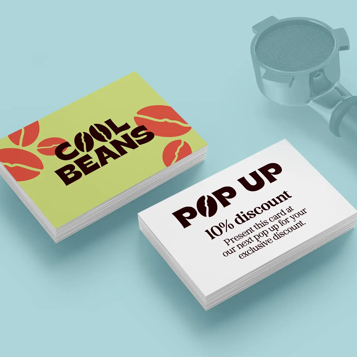 Stack of next day business cards with a top card revealing premium print quality and fast turnaround service.