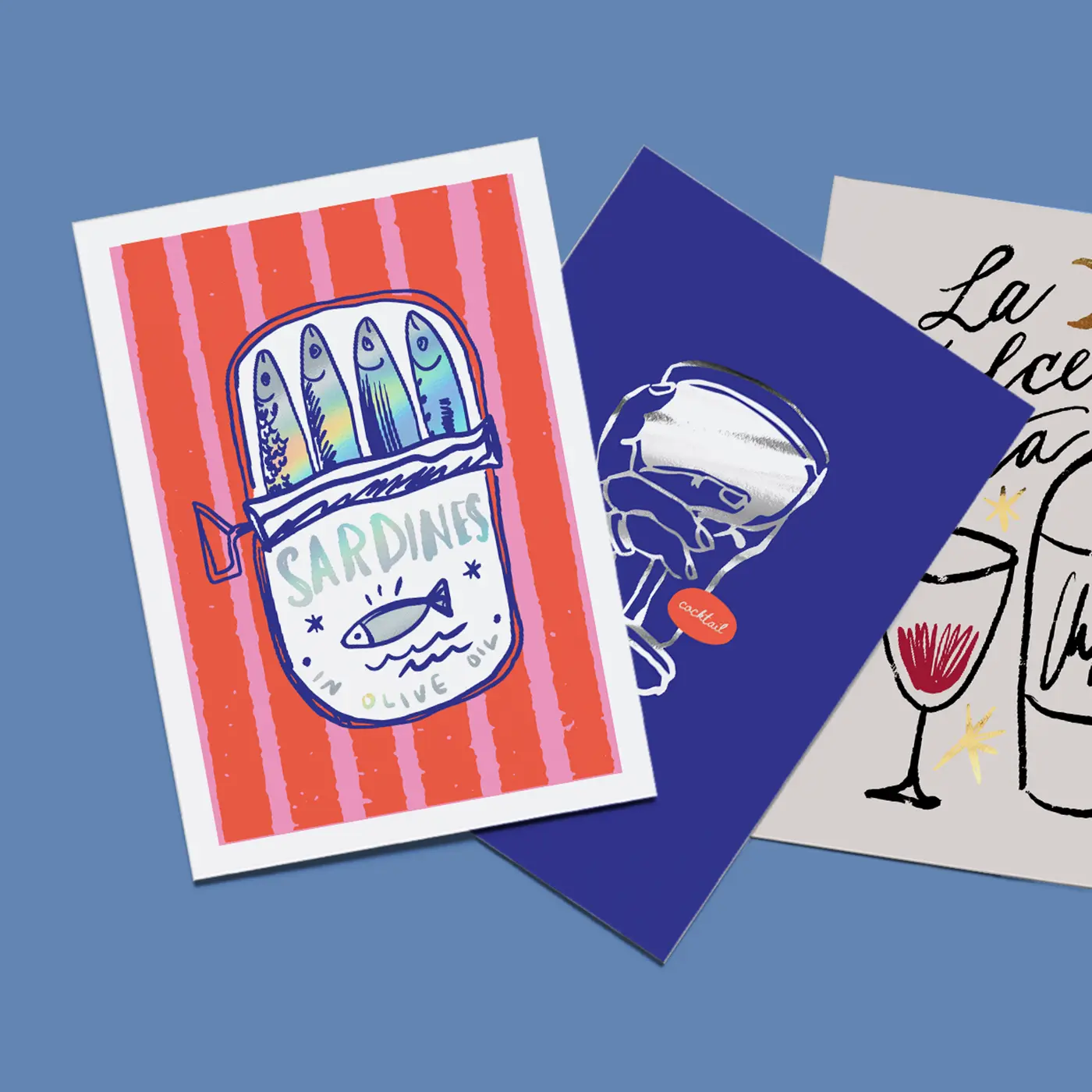 Foil Art Prints featuring colourful foiled artwork and graphic designs, including a sardine tin, cocktail glass and hand-drawn sketch.